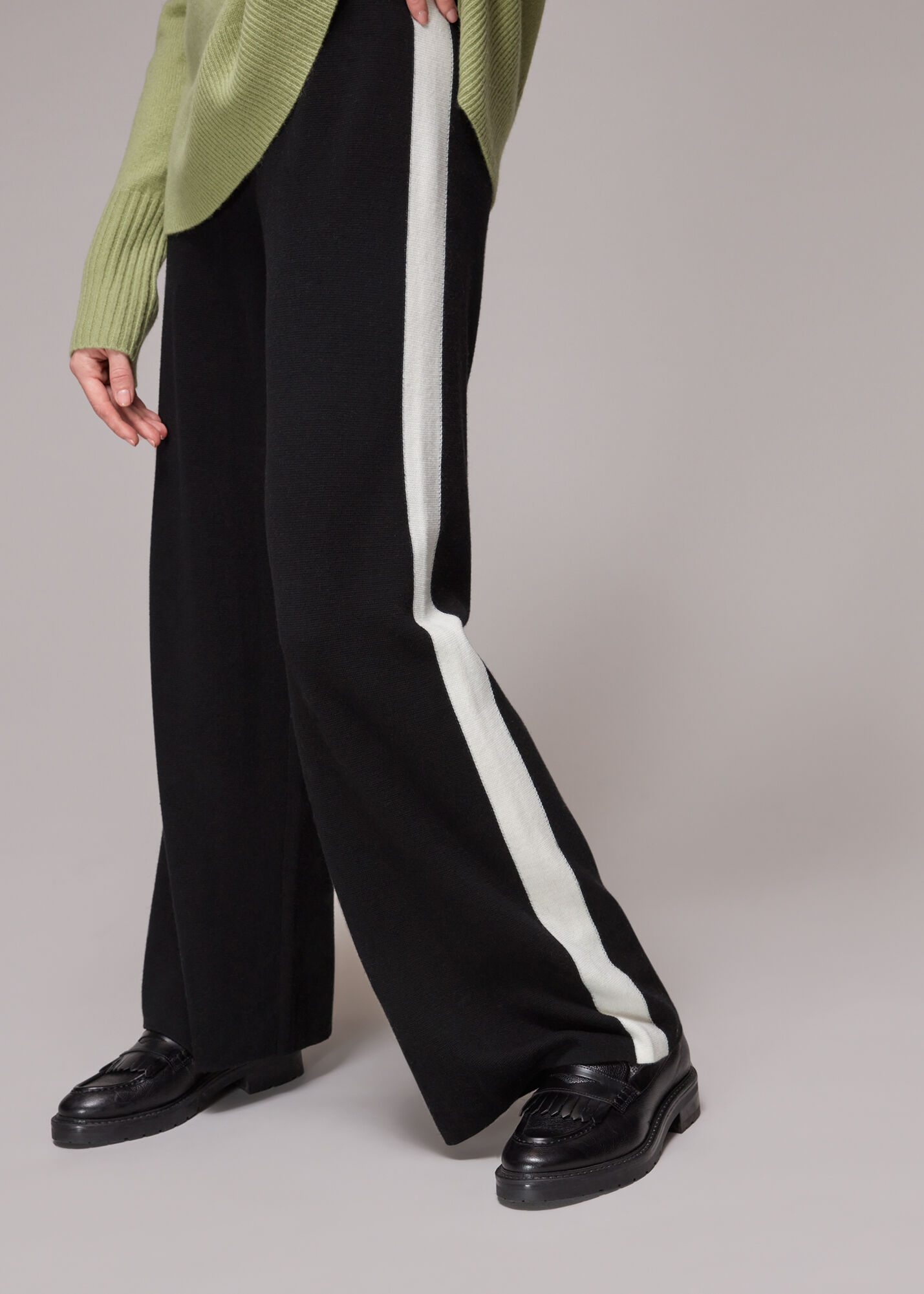 White trousers with shop black side stripe