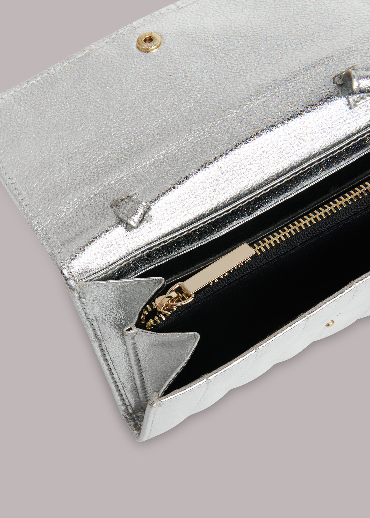 Whistles store silver clutch