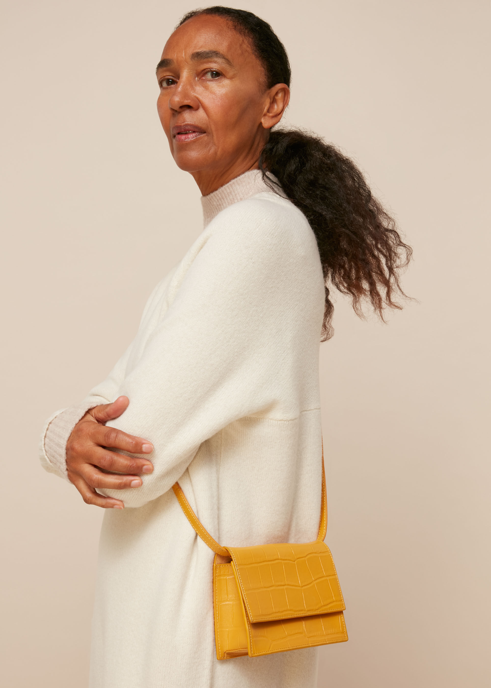 Suri small python store embossed crossbody bag