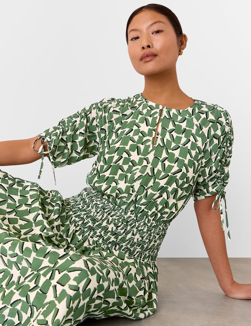 woman wearing green dress
