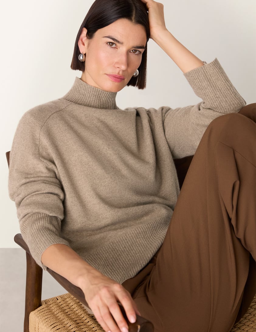 woman wearing funnel neck jumpers