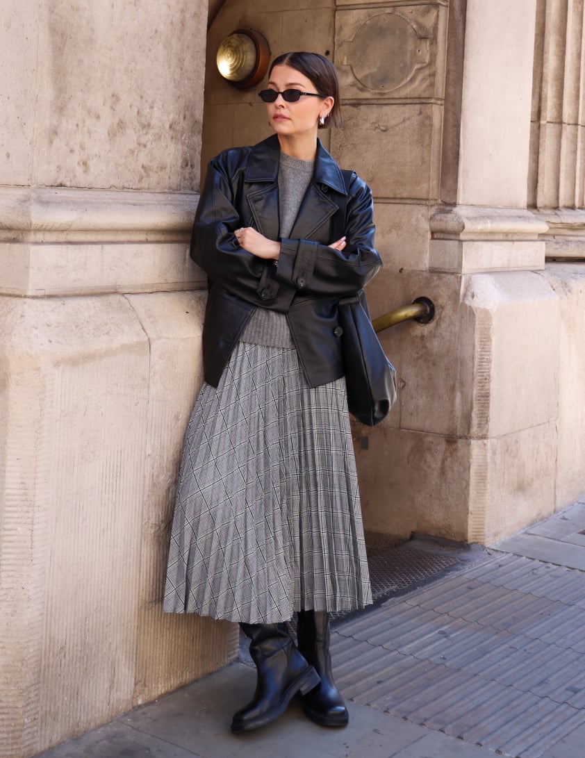 Black leather loafers styled with a lace-trim skirt