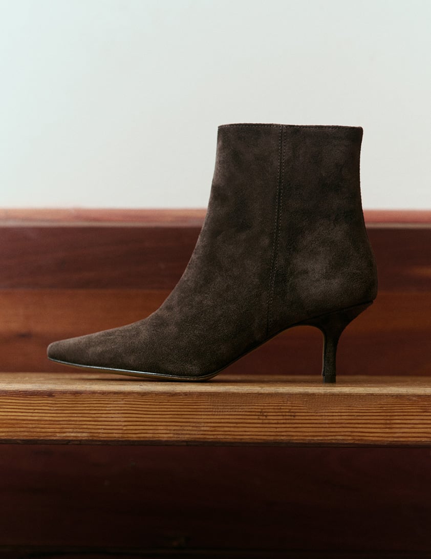 woman wearing shearling leather jacket with jeans