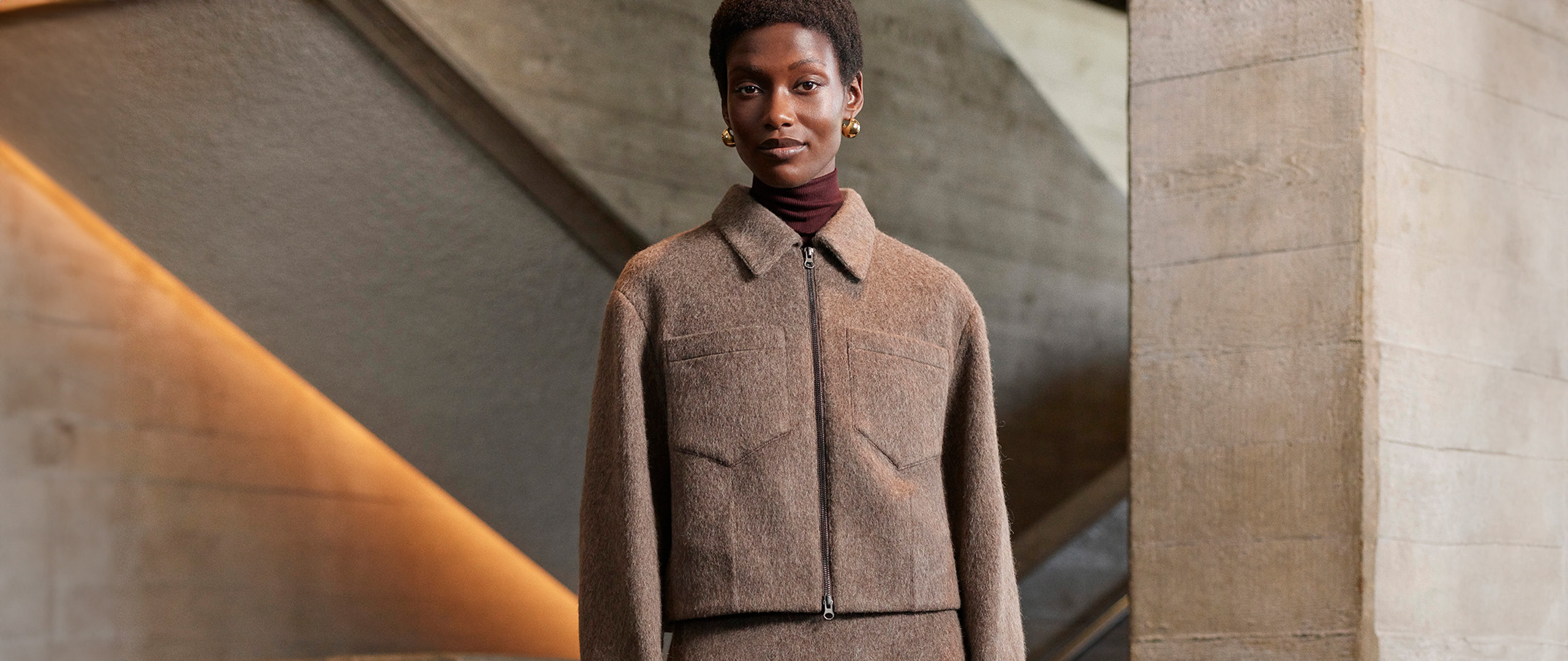 Whistles women’s taupe wool zip jacket layered over burgundy roll neck