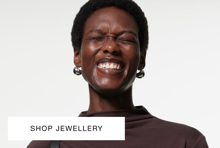 Whistles large classic silver stud earrings worn by model in chocolate brown dress