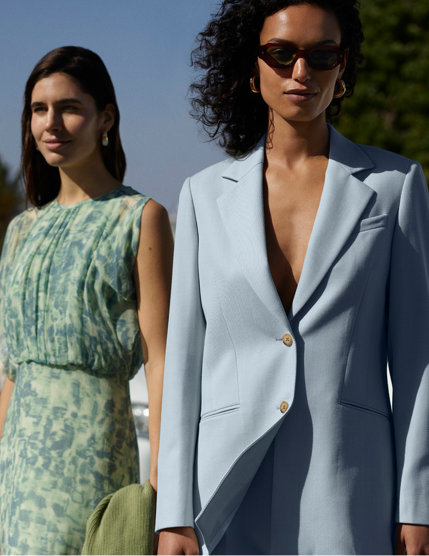 2 woman wearing dresses and blue blazer