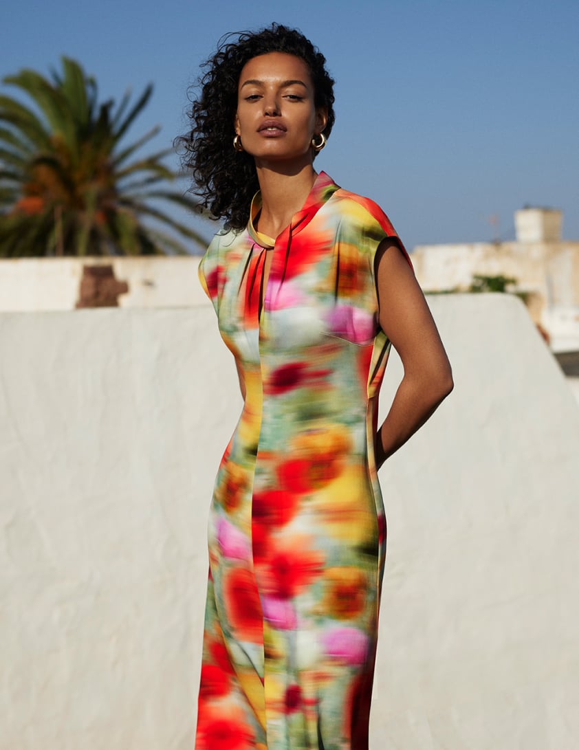 woman wearing red printed dress 