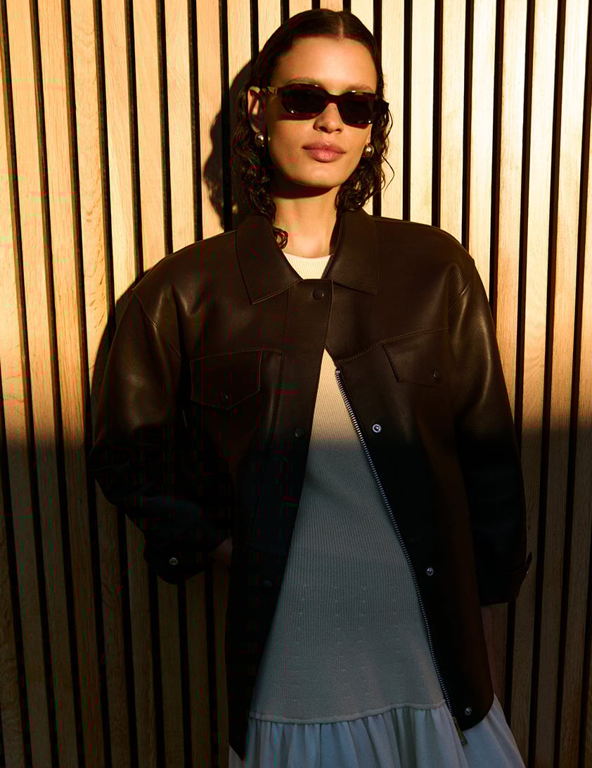 woman wearing shearling leather jacket with jeans