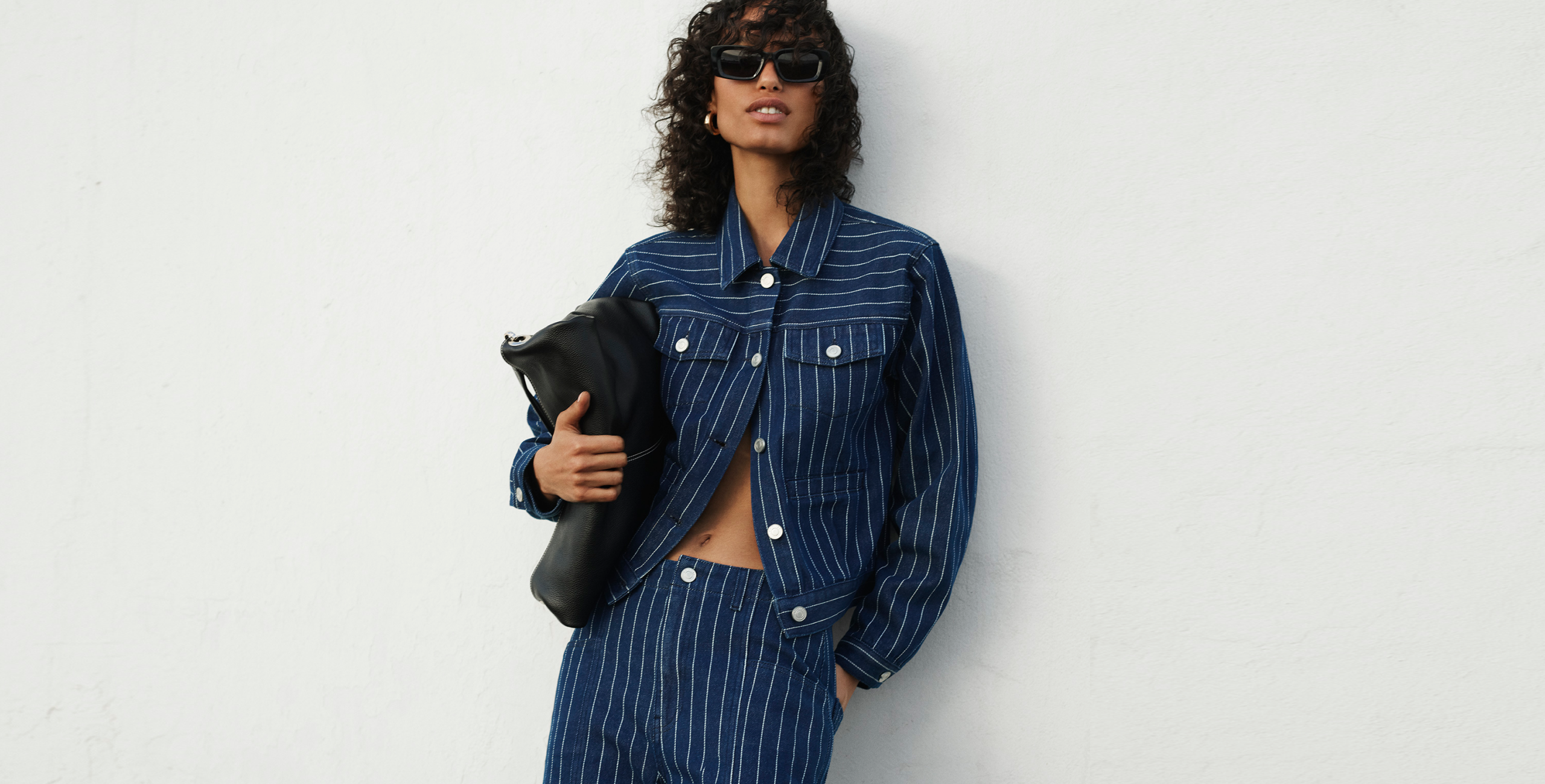 woman wearing blue pinstripe denim jeand and jacket