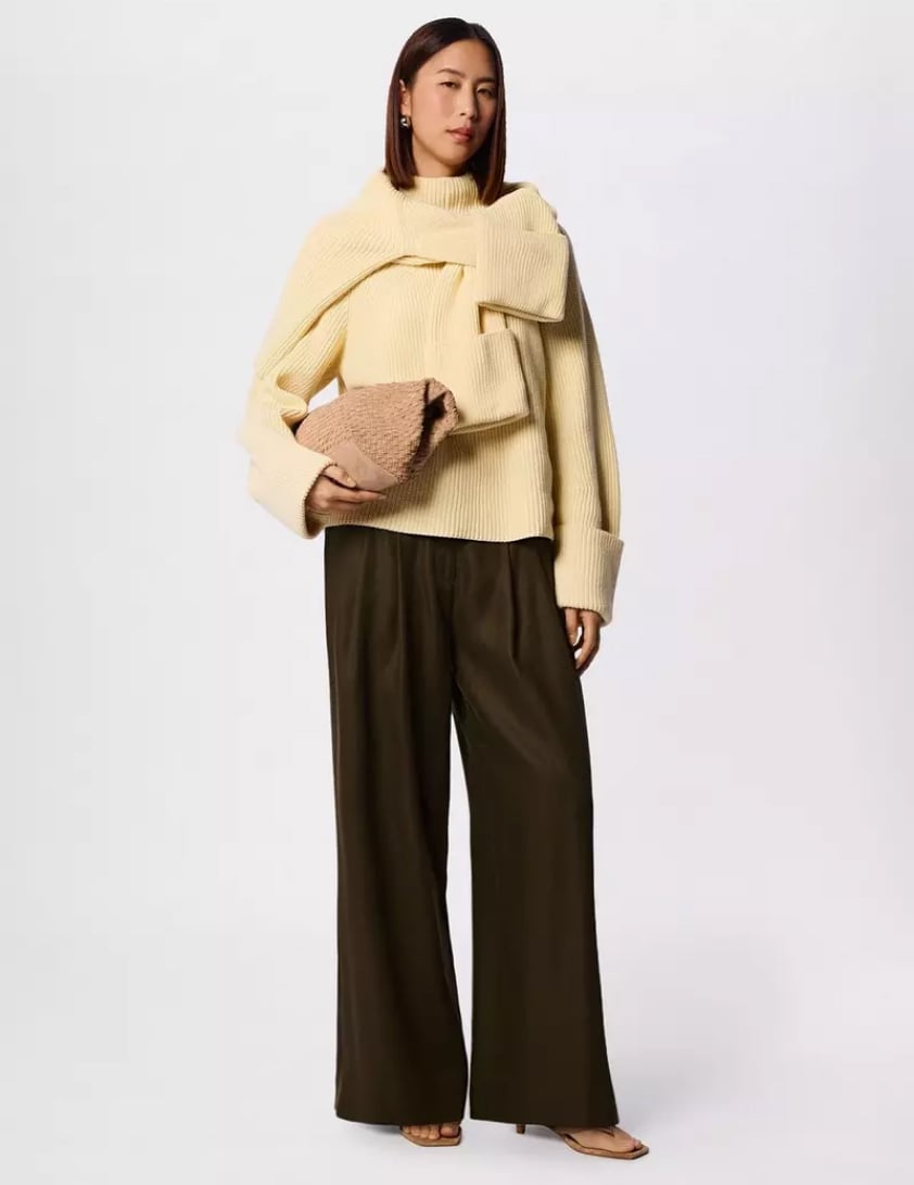 woman wearing shearling leather jacket with jeans