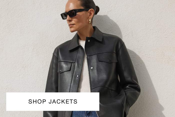 woman wearing whistles black leather jacket