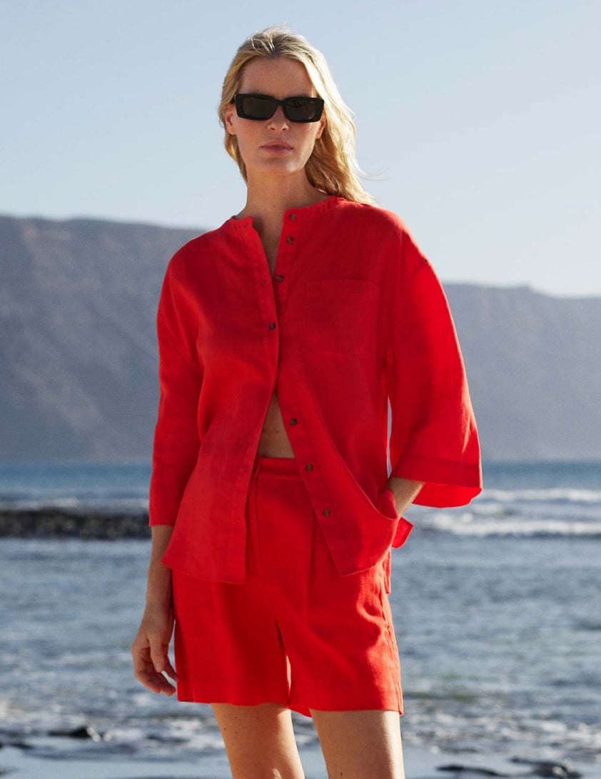Woman wearing red shorts linen co-ord