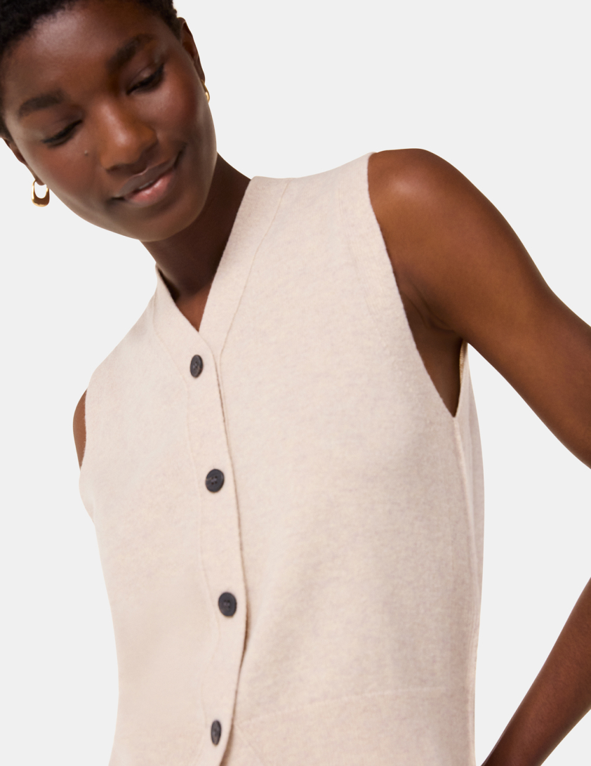 woman wearing cream tank top