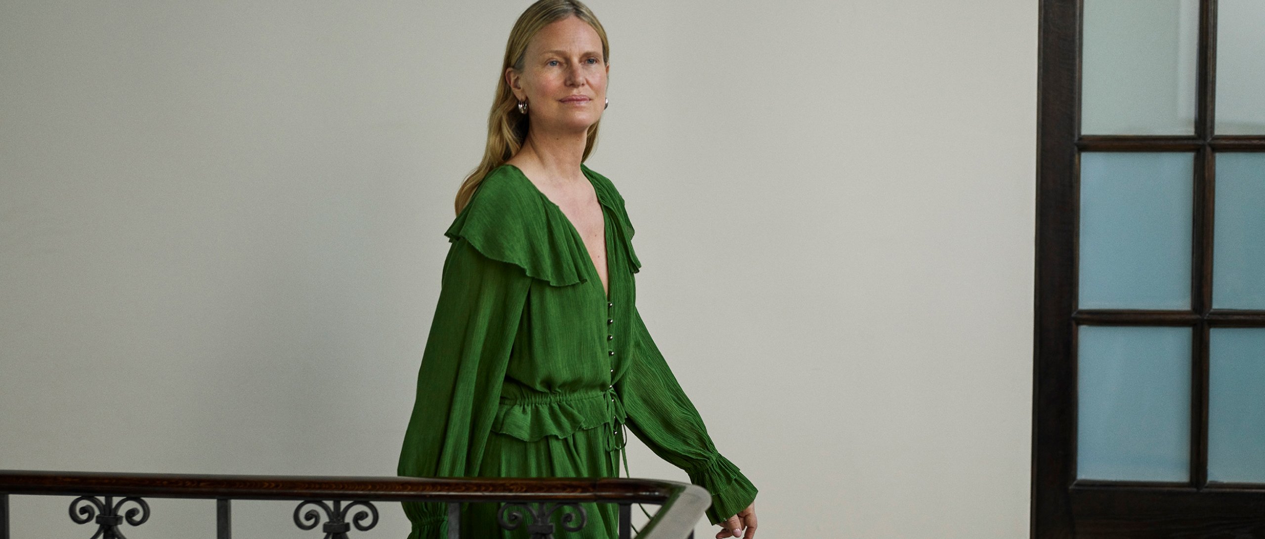 woman wearing green frill dress