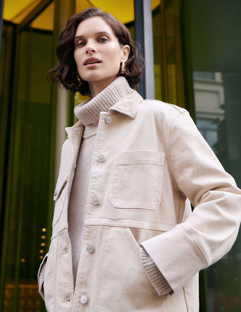 Woman wearing cream jacket