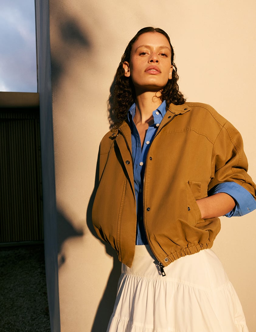 woman wearing funnel neck jumpers