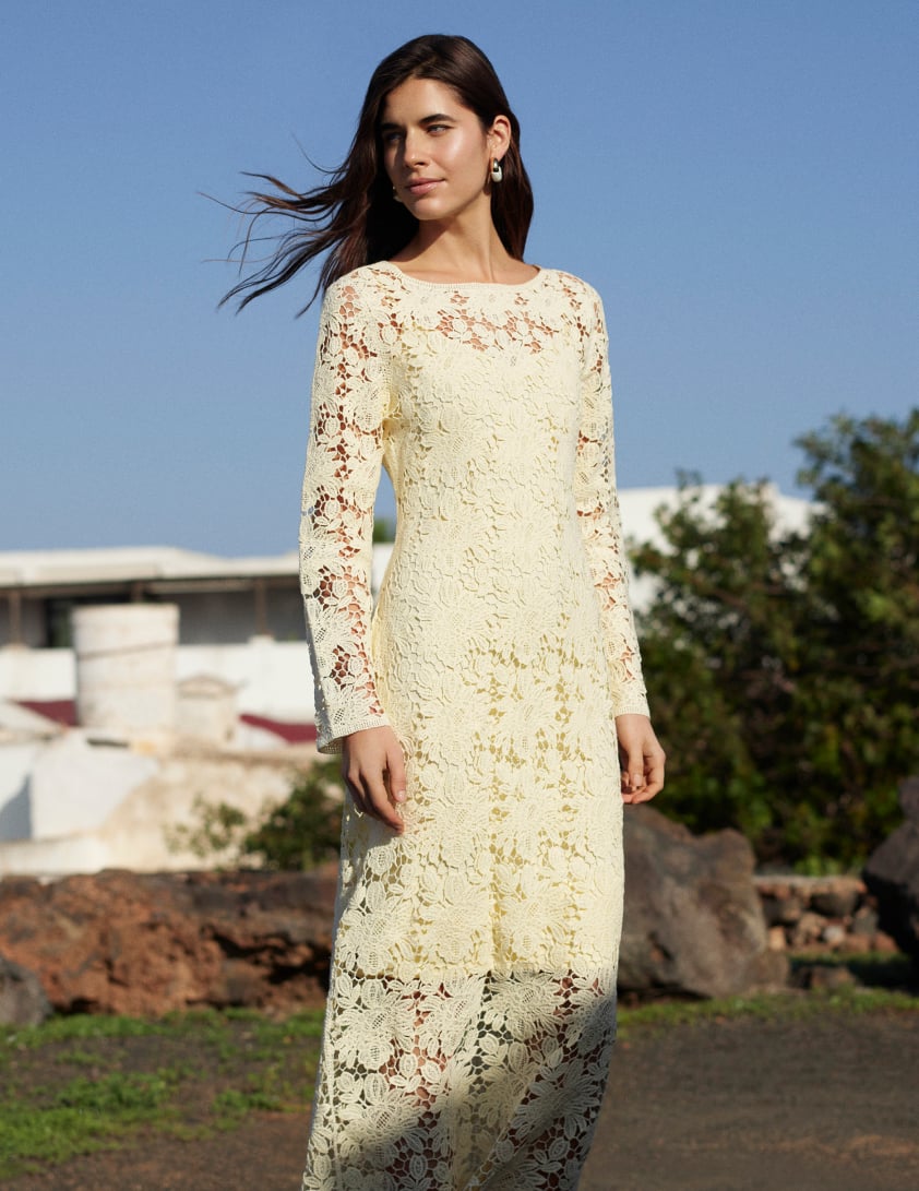 woman wearing crochet knit dress