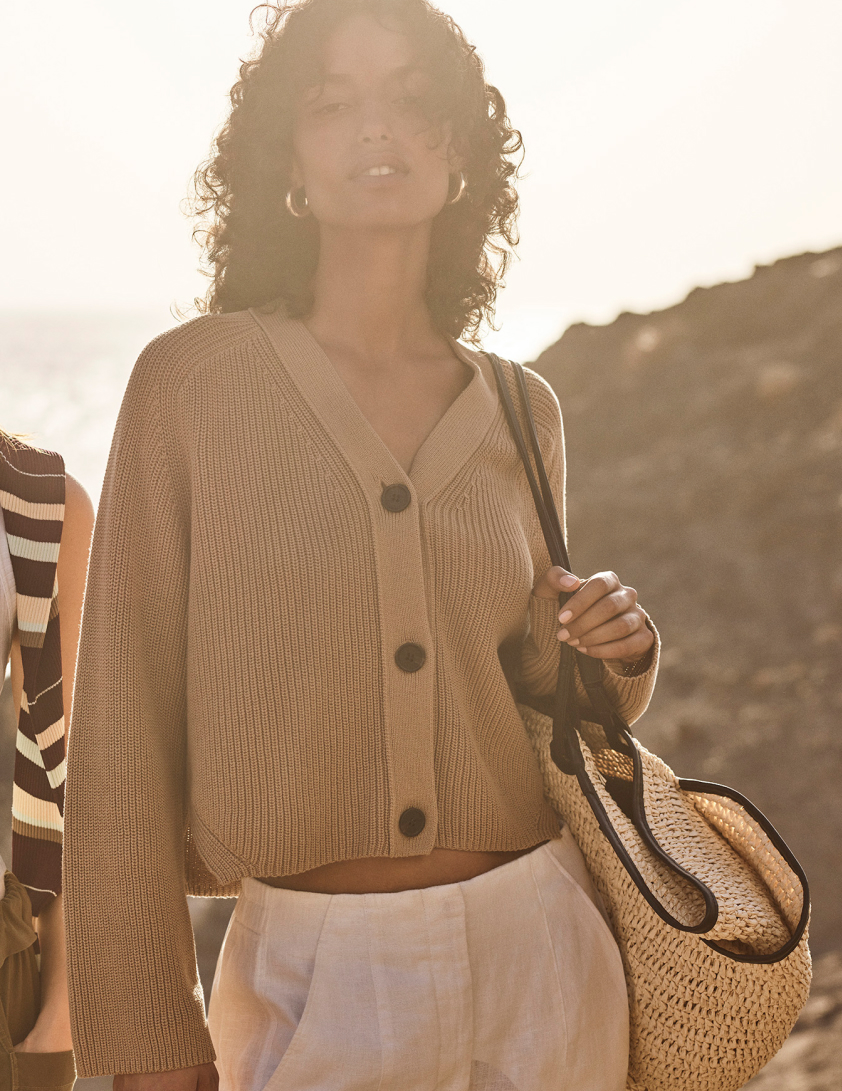 Woman wearing cream cardigan