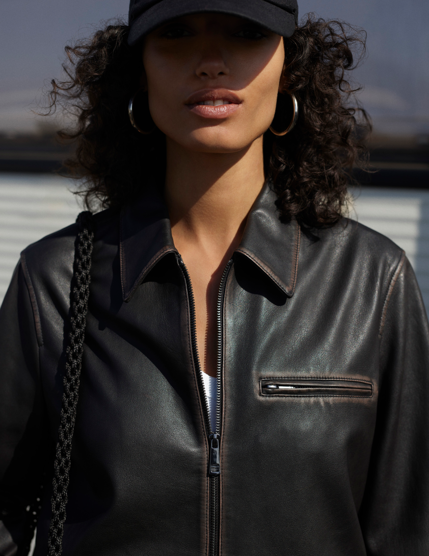 Woman wearing brown leather jacket