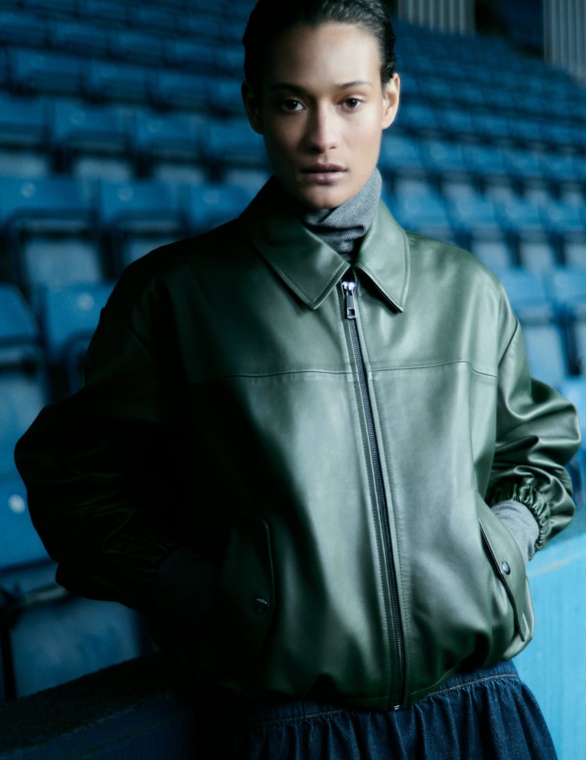 woman wearing shearling leather jacket with jeans