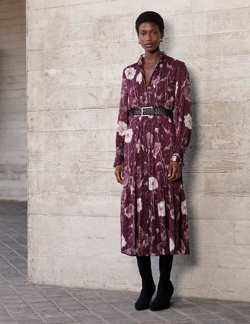 Woman wearing Whistles burgundy floral printed midi dress