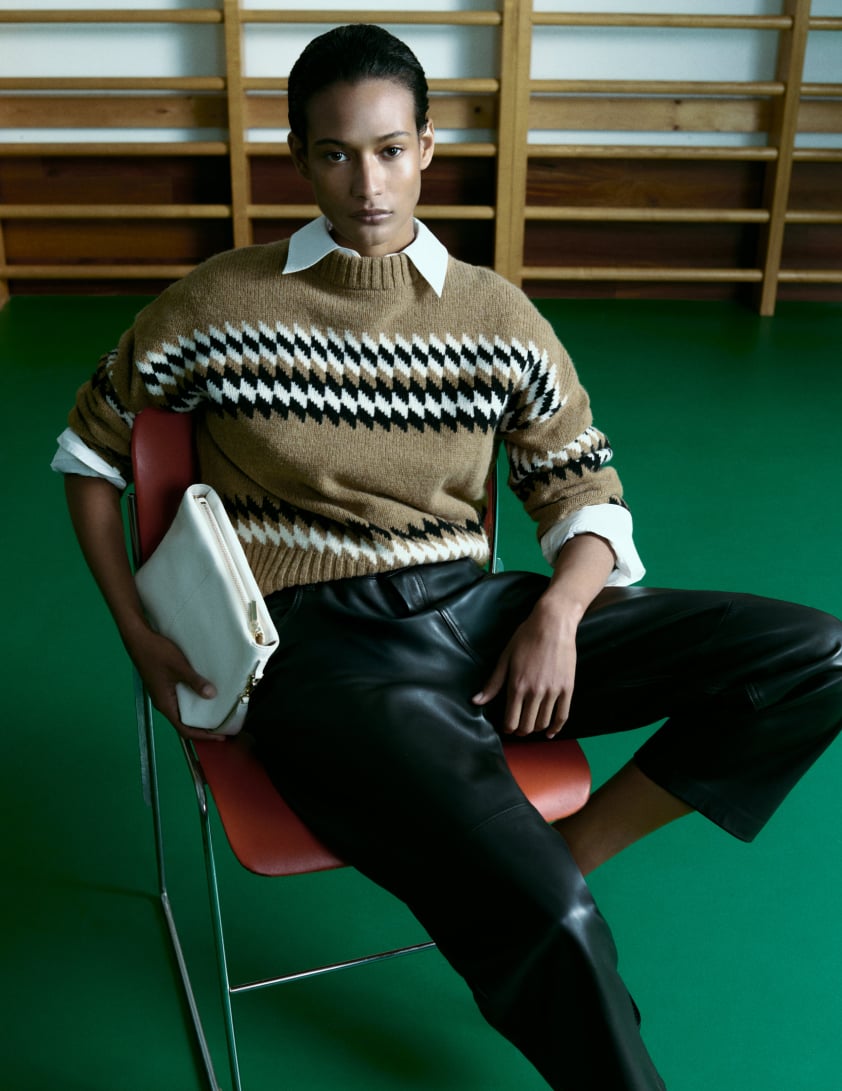 woman wearing funnel neck jumpers